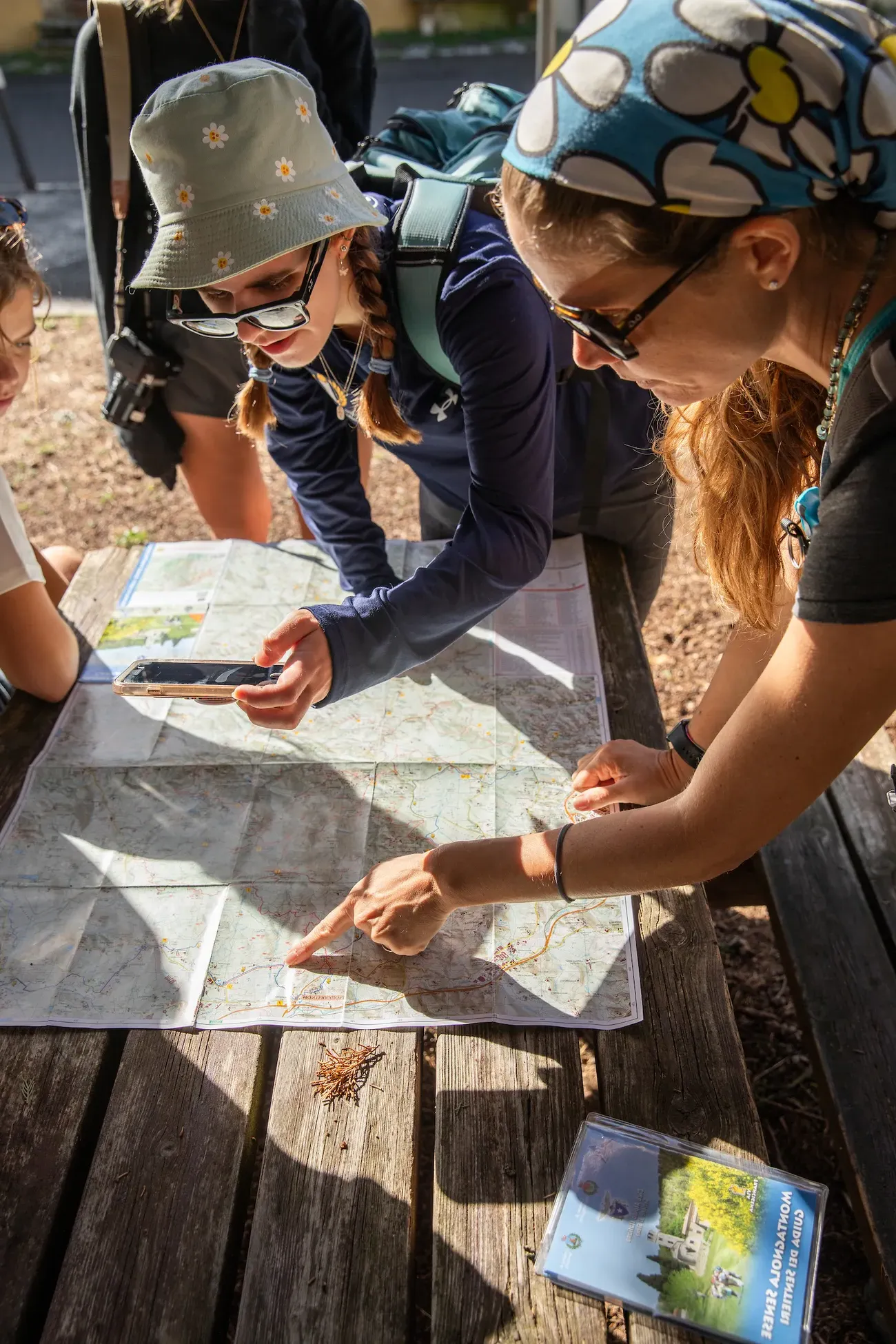 People sitting around a map.